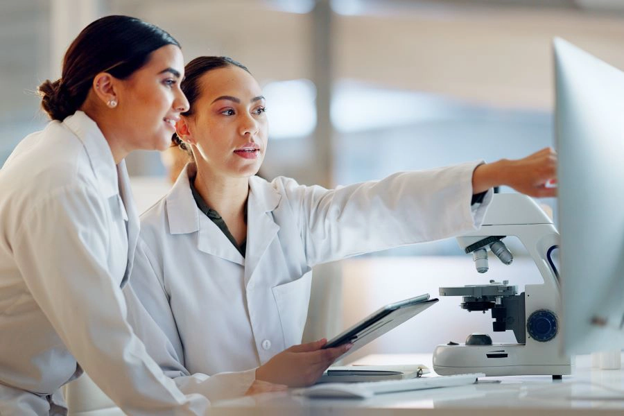 Two researchers working with a computer